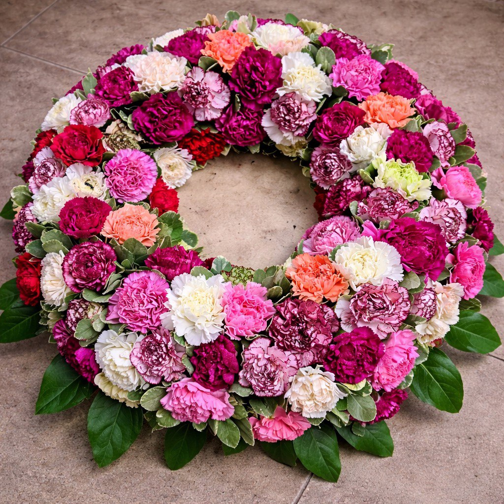 Trauerkranz mit Nelken in sanften Farben